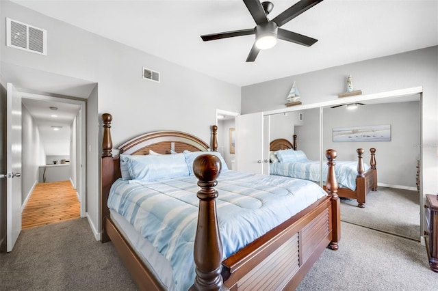 carpeted bedroom featuring ceiling fan