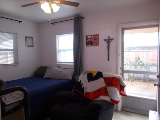 bedroom with light carpet and ceiling fan