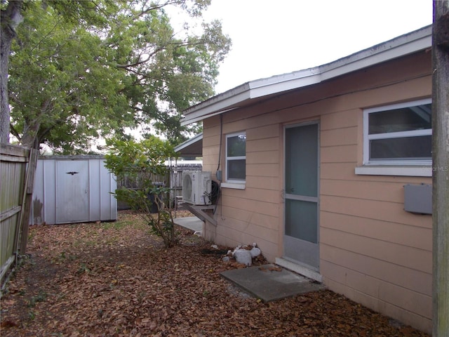 view of home's exterior with a storage unit