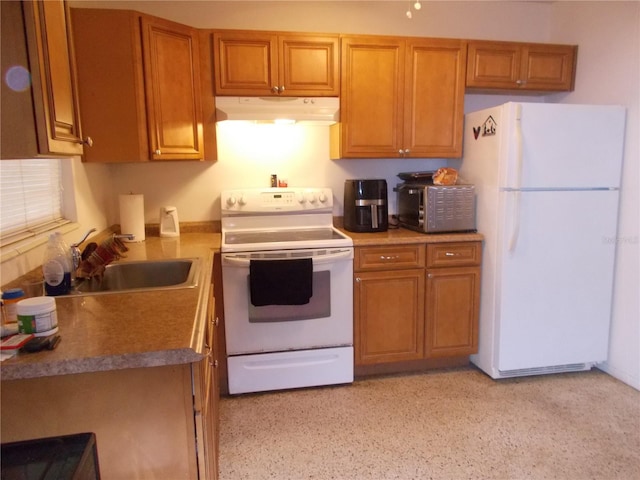 kitchen featuring white appliances and sink