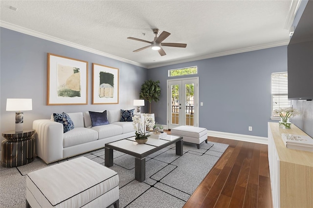 living room featuring french doors, ceiling fan, a textured ceiling, light wood-type flooring, and ornamental molding