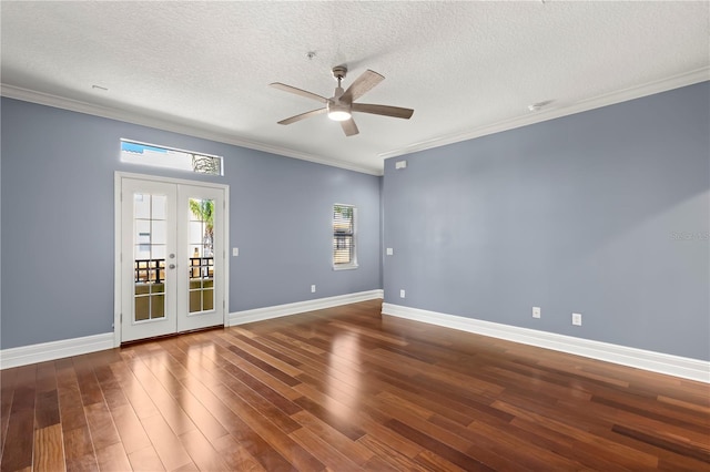 unfurnished room featuring ornamental molding, dark hardwood / wood-style flooring, french doors, and ceiling fan