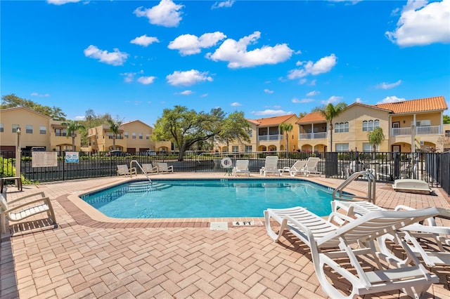 view of swimming pool with a patio