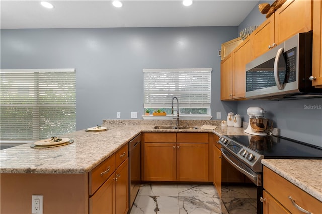 kitchen featuring electric range, sink, light stone countertops, and light tile floors