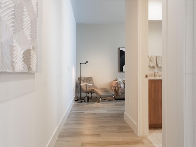 corridor featuring light hardwood / wood-style floors