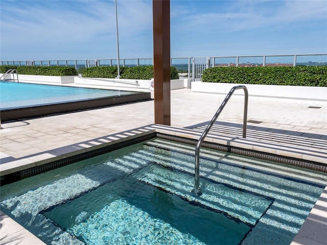 view of swimming pool featuring a patio