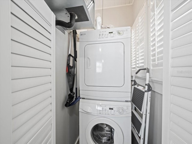 laundry room with stacked washer and dryer