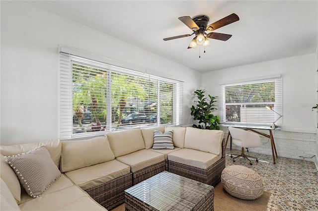 living room with a healthy amount of sunlight and ceiling fan