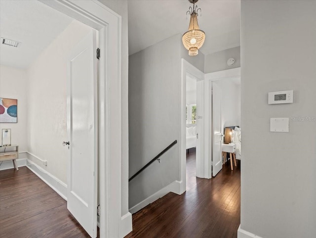 corridor with dark wood-type flooring