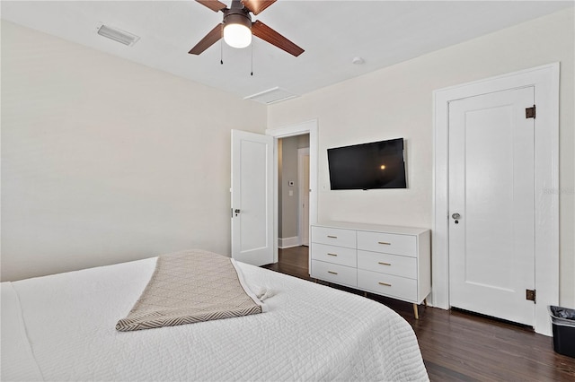 bedroom with ceiling fan and dark hardwood / wood-style flooring