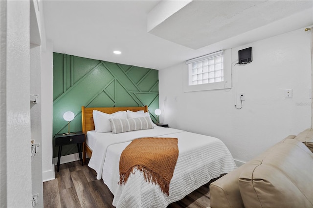 bedroom featuring dark hardwood / wood-style flooring