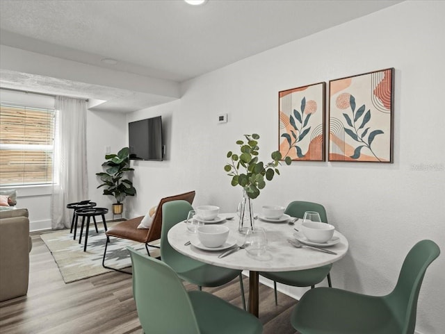 dining area with light hardwood / wood-style flooring