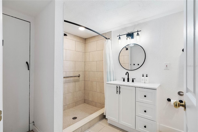 bathroom featuring tile floors, a textured ceiling, vanity, and a shower with shower curtain