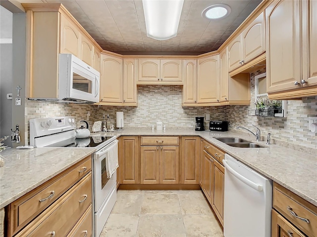 kitchen featuring tasteful backsplash, white appliances, sink, and light tile floors