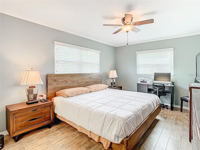 bedroom with light wood-type flooring, ceiling fan, and multiple windows