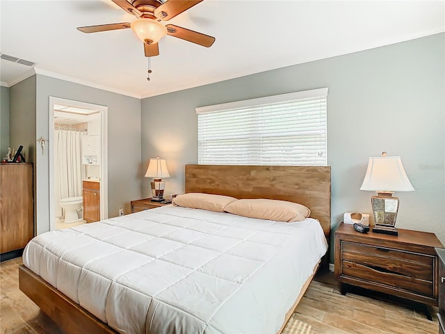 bedroom with ensuite bathroom, ornamental molding, ceiling fan, and light wood-type flooring