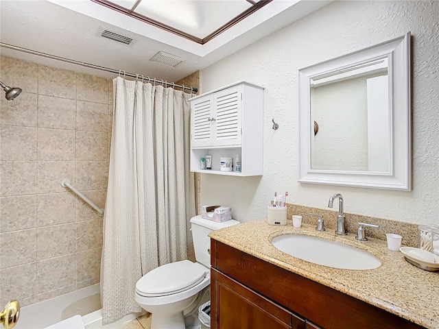 bathroom with large vanity and toilet