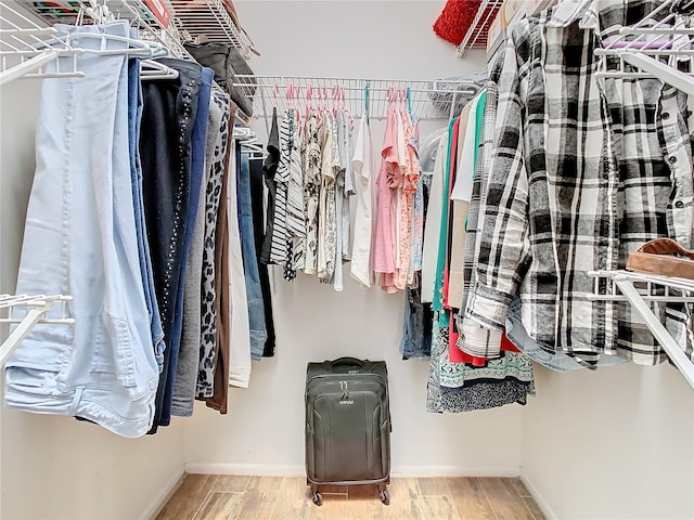 walk in closet featuring light wood-type flooring