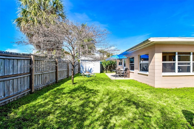 view of yard with a patio area and a shed