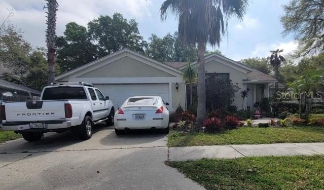 ranch-style house featuring a garage