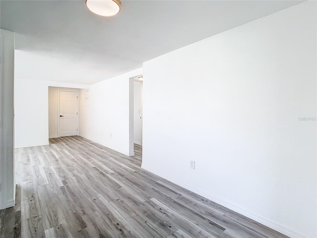 spare room featuring hardwood / wood-style flooring