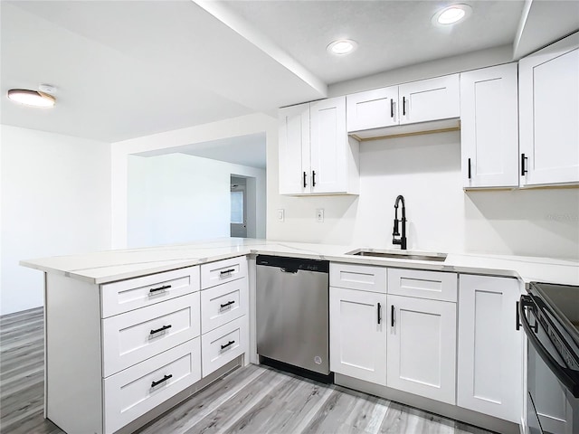 kitchen featuring black electric range, stainless steel dishwasher, white cabinetry, light wood-type flooring, and kitchen peninsula