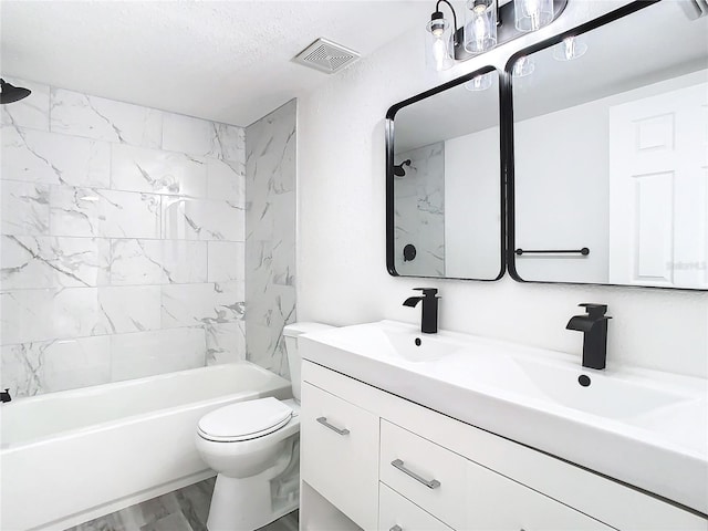 full bathroom with a textured ceiling, tiled shower / bath combo, toilet, vanity, and hardwood / wood-style flooring