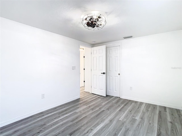 empty room featuring hardwood / wood-style floors