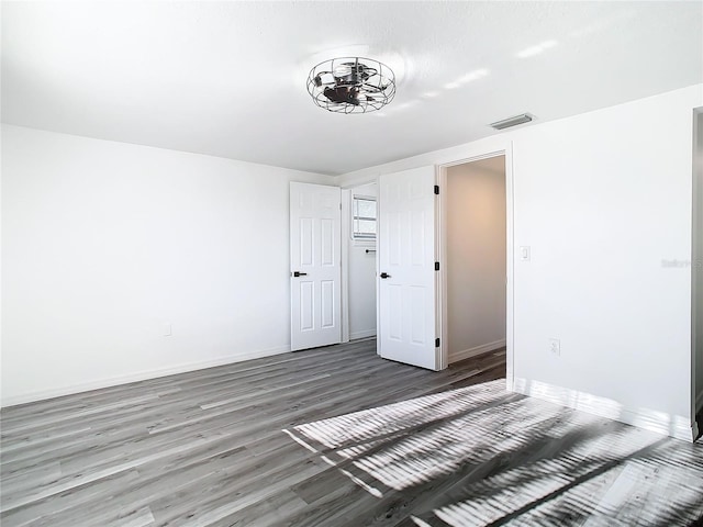 spare room featuring hardwood / wood-style floors