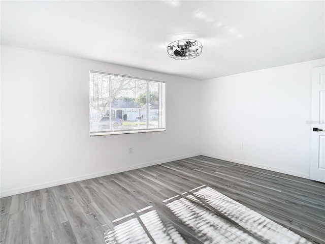 spare room with hardwood / wood-style flooring