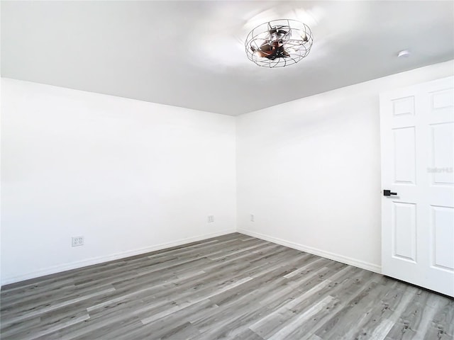 unfurnished room featuring hardwood / wood-style floors