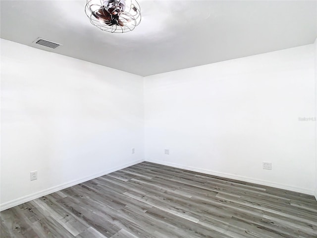 spare room with hardwood / wood-style floors