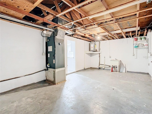 basement with electric water heater and heating unit