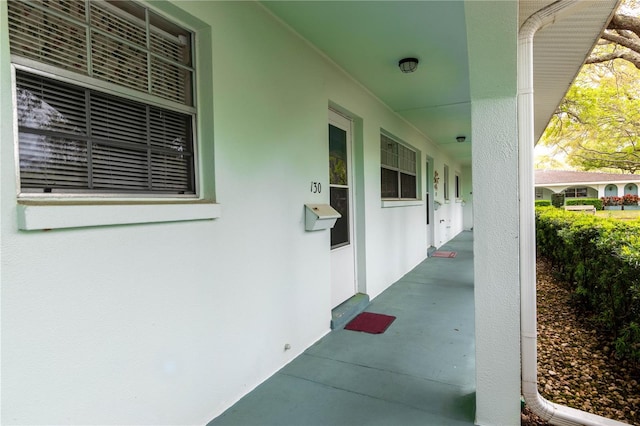 property entrance featuring covered porch