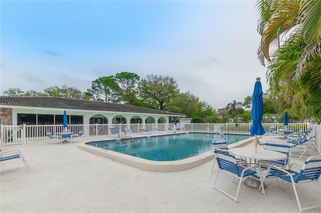 view of swimming pool featuring a patio