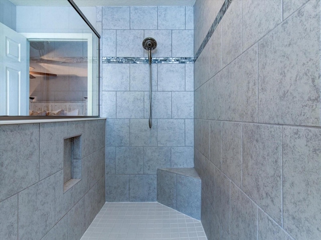 bathroom with tiled shower