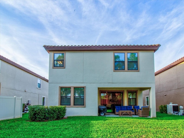 rear view of property featuring outdoor lounge area, a lawn, and central AC