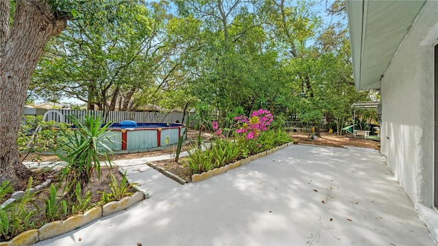 view of terrace featuring a fenced in pool