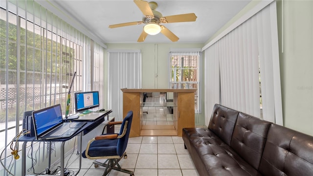 home office with light tile floors and ceiling fan