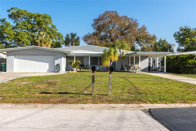 ranch-style house with a front yard, a garage, and a carport