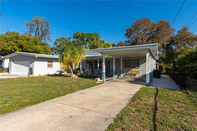 ranch-style house featuring a carport, a front lawn, and a garage