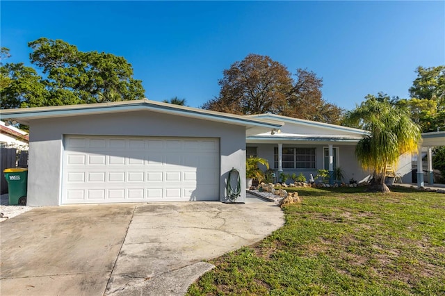 ranch-style home with a front yard and a garage