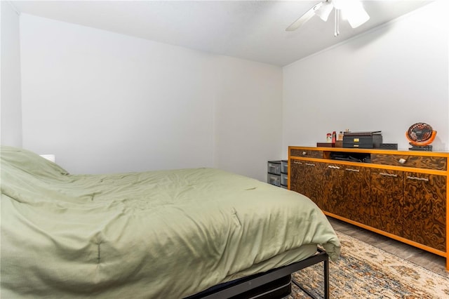 bedroom with hardwood / wood-style floors and ceiling fan