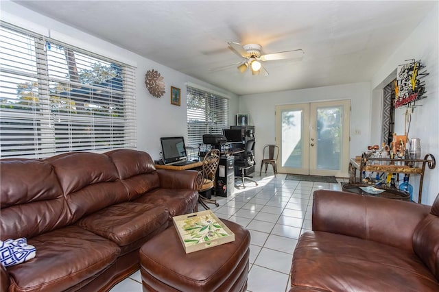 tiled living room featuring french doors and ceiling fan