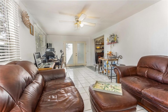 living room featuring french doors, light tile patterned floors, and ceiling fan