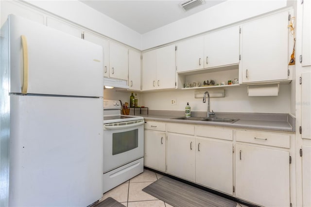 kitchen featuring sink, white cabinetry, white appliances, and light tile patterned floors