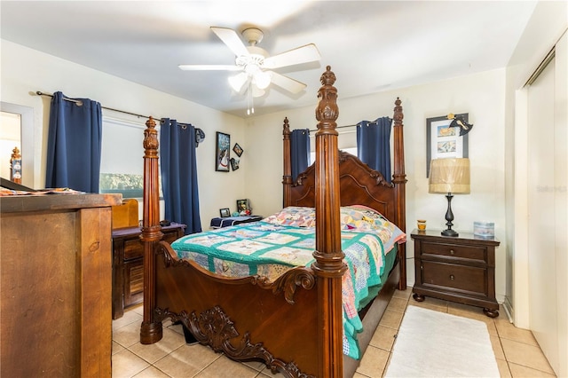 bedroom featuring a closet, light tile patterned flooring, and ceiling fan