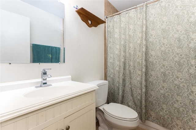 bathroom featuring vanity, toilet, and a shower with curtain