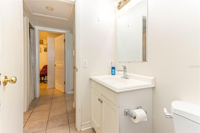 bathroom featuring vanity, toilet, and tile patterned floors