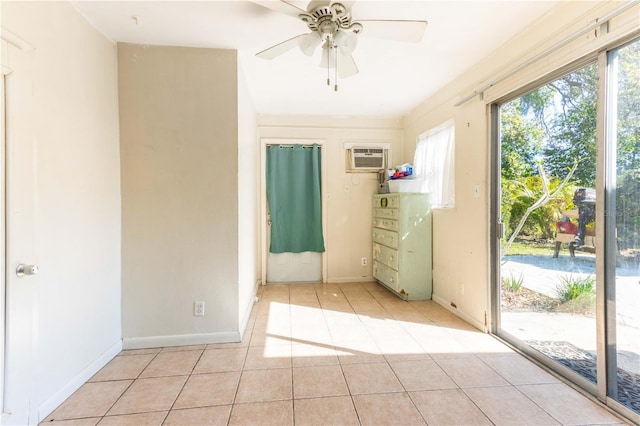 unfurnished bedroom featuring access to outside, an AC wall unit, light tile patterned flooring, and ceiling fan